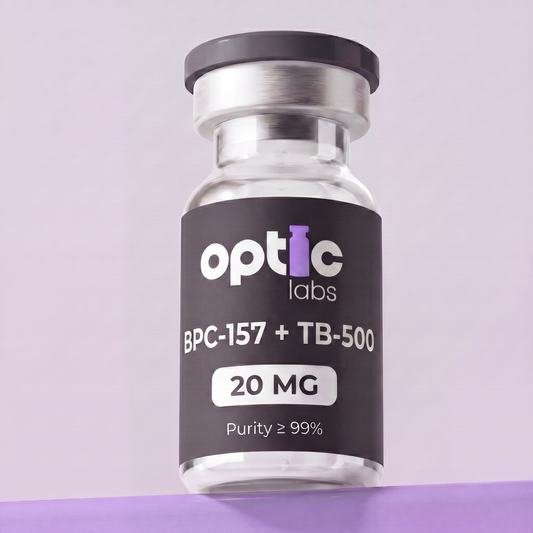 A clear vial of Optic Labs BPC-157 + TB-500 10mg/20mg, Purity ≥99%, with a black and purple label, is shown against a light purple background. Optic Labs Au