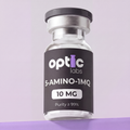 A clear vial labeled "Optic Labs 5-Amino-1MQ 10mg" (Purity ≥99%) sits against a light purple background, sealed with a silver cap. This Australian peptide is known for supporting metabolic regulation. Optic Labs Au