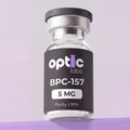 A clear vial labeled Optic Labs BPC-157 5mg/10mg, with a black label featuring white and purple text, stands upright against a soft purple background, highlighting this high-purity, lab-tested peptide. Optic Labs Au