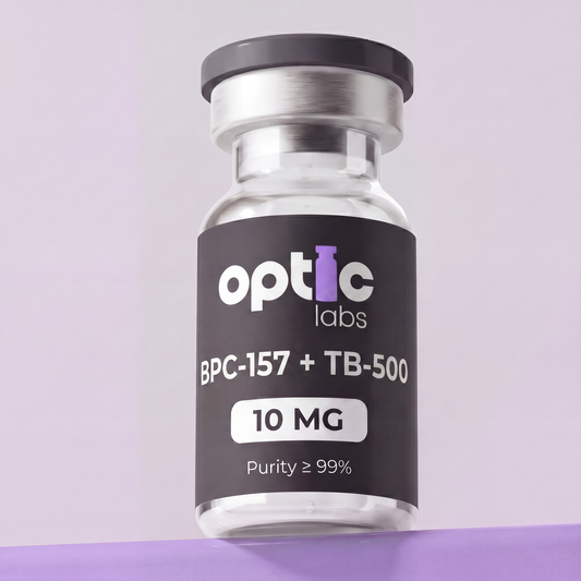 A glass vial labeled Optic Labs BPC-157 + TB-500 10mg / 20mg, featuring a silver cap and set against a light purple background. Optic Labs Au
